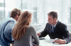 Personal Loan Agreement Solicitors. Private lending. Photo of couple meeting lawyer